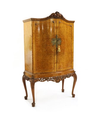 Lot 300 - A burr walnut cocktail cabinet