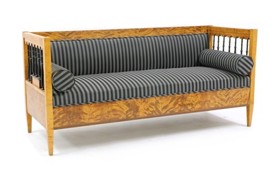 Lot 289 - A Biedermeier style satinwood and ebonised settee