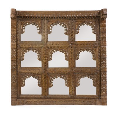 Lot 298 - An Indian carved and mirrored panel