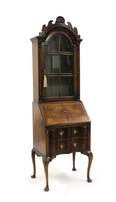 Lot 291 - A Queen Anne style walnut bureau bookcase