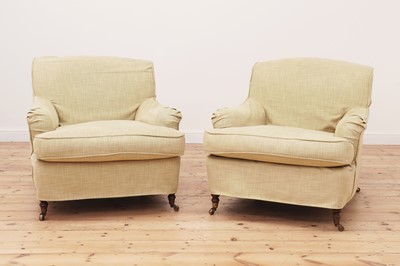 Lot 540 - A pair of Howard-style armchairs by George Smith