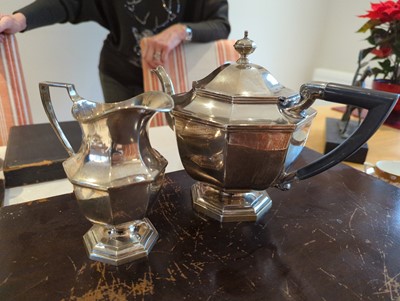 Lot 1 - A Mappin and Webb silver teapot and cream jug