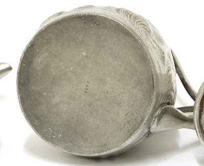 Lot 160 - An Arts and Crafts pewter jug