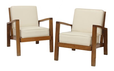Lot 629 - A pair of teak lounge chairs