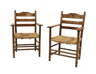 Lot 386 - A pair of Gordon Russell oak armchairs