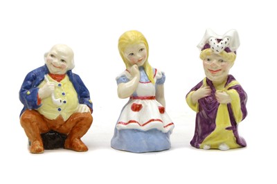 Lot 102 - A group of three Royal Worcester porcelain candle snuffers