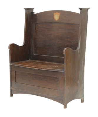 Lot 142 - An Arts and Crafts oak settle