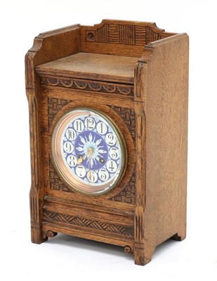 Lot 126 - An Aesthetic Movement oak mantel clock