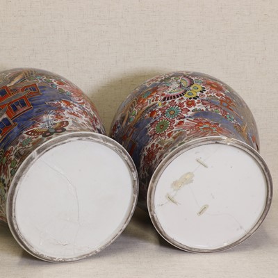 Lot 44 - Two Chinese clobbered blue and white vases and covers