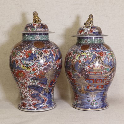 Lot 44 - Two Chinese clobbered blue and white vases and covers