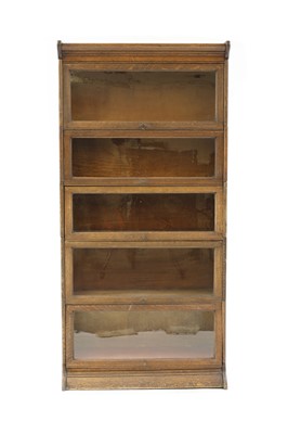 Lot 426 - An oak five section modular bookcase by Gunn