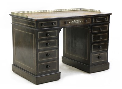 Lot 359 - An ebonised pedestal desk