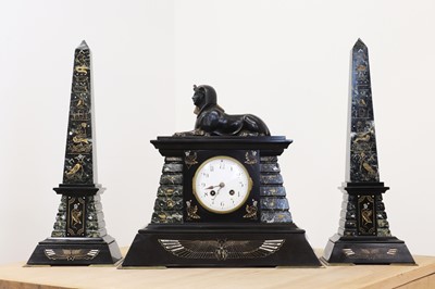 Lot 455 - A green and black marble Egyptian Revival clock garniture