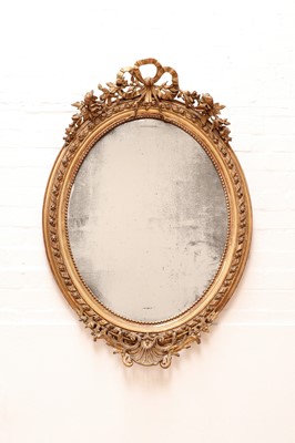 Lot 602 - A gilt-framed oval mirror