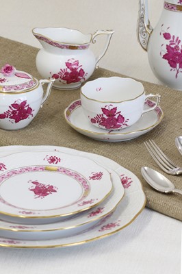 Lot 578 - A porcelain 'Apponyi Purple' part dinner service by Herend