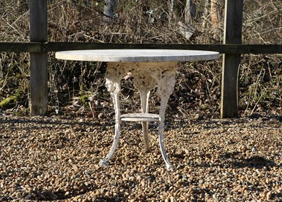 Lot 444 - A Britannia cast iron marble top garden table