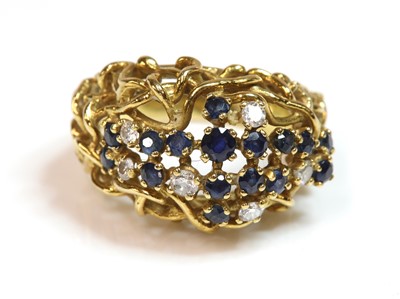 Lot 229 - A sapphire and diamond bombé ring, c.1970