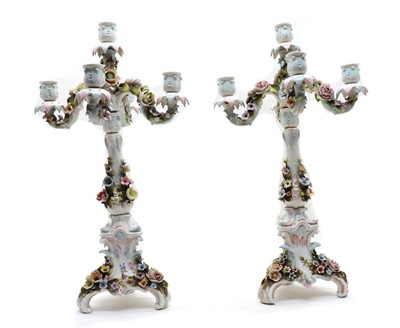 Lot 104 - A near pair of Sitzendorf five light candelabra