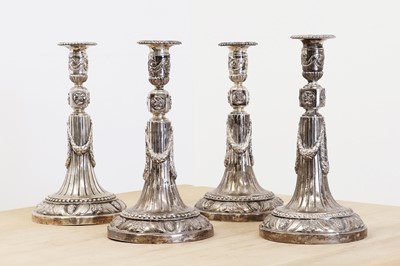 Lot 582 - A set of four German silver candlesticks