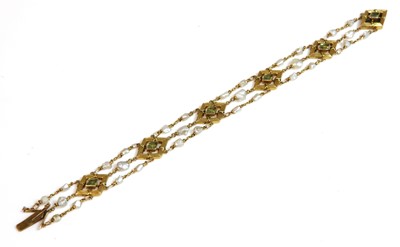 Lot 120 - An Edwardian peridot and freshwater pearl bracelet, c.1905