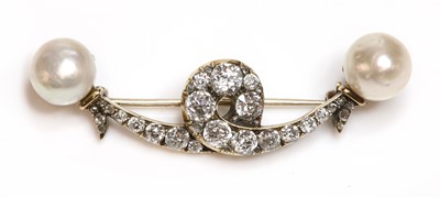 Lot 87 - A cased Victorian diamond and pearl set ribbon brooch