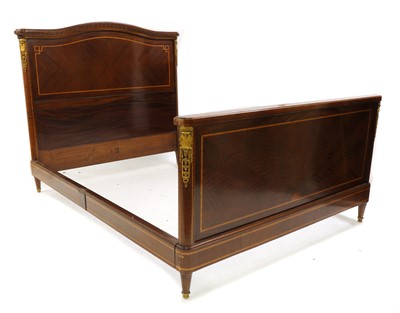 Lot 364 - A French mahogany inlaid and gilt-bronze mounted bed