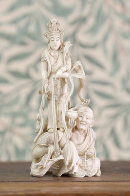 Lot 426 - An ivory okimono