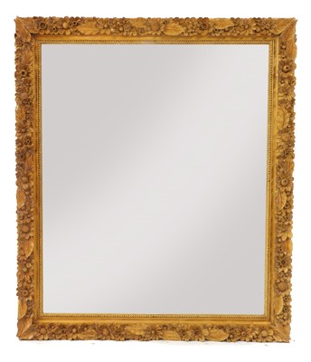 Lot 404A - A large carved softwood wall mirror
