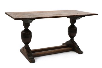 Lot 413 - An oak dining table