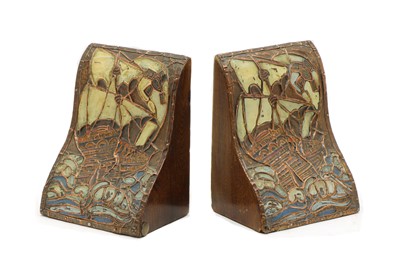 Lot 231 - A pair of Arts and Crafts enamelled copper bookends