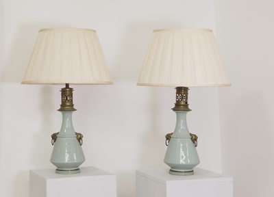 Lot 41 - A pair of Napoleon III celadon-glazed pottery table lamps