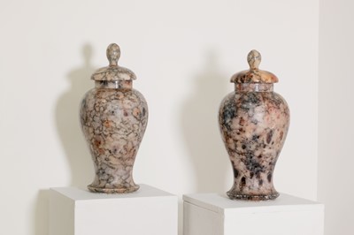 Lot 143 - A pair of rouge alabaster vases and covers
