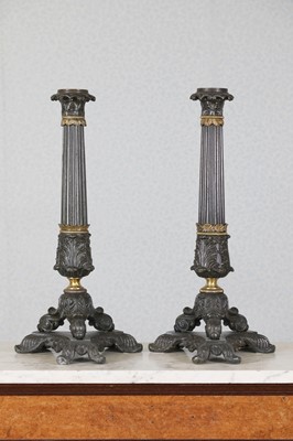 Lot 222 - A pair of Louis Phillipe spelter triform sinumbra lamp bases