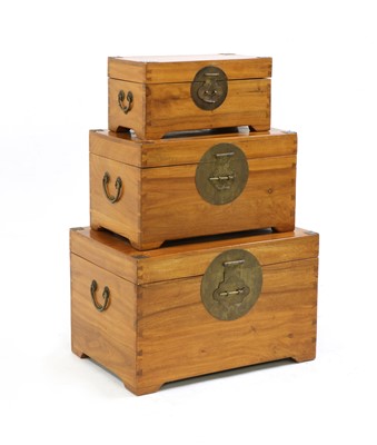 Lot 338 - A graduated set of three camphorwood chests
