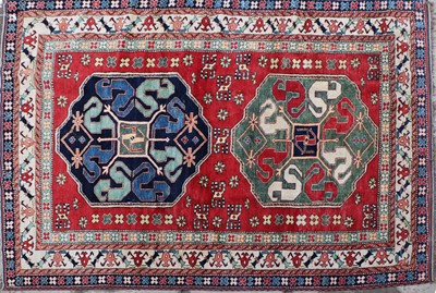 Lot 324 - A hand knotted Kazak wool rug