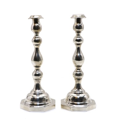 Lot 11 - A pair of silver candlesticks