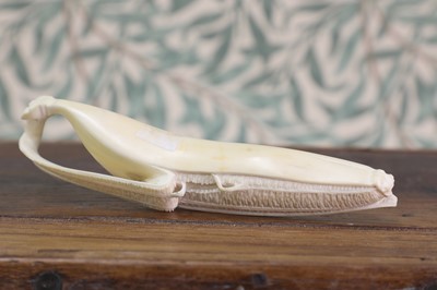 Lot 427 - A carved ivory okimono