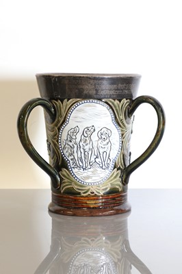 Lot 31 - A three-handled Doulton Lambeth stoneware tyg