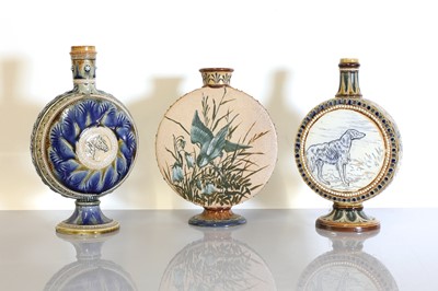 Lot 40 - Three Doulton Lambeth stoneware moon flasks