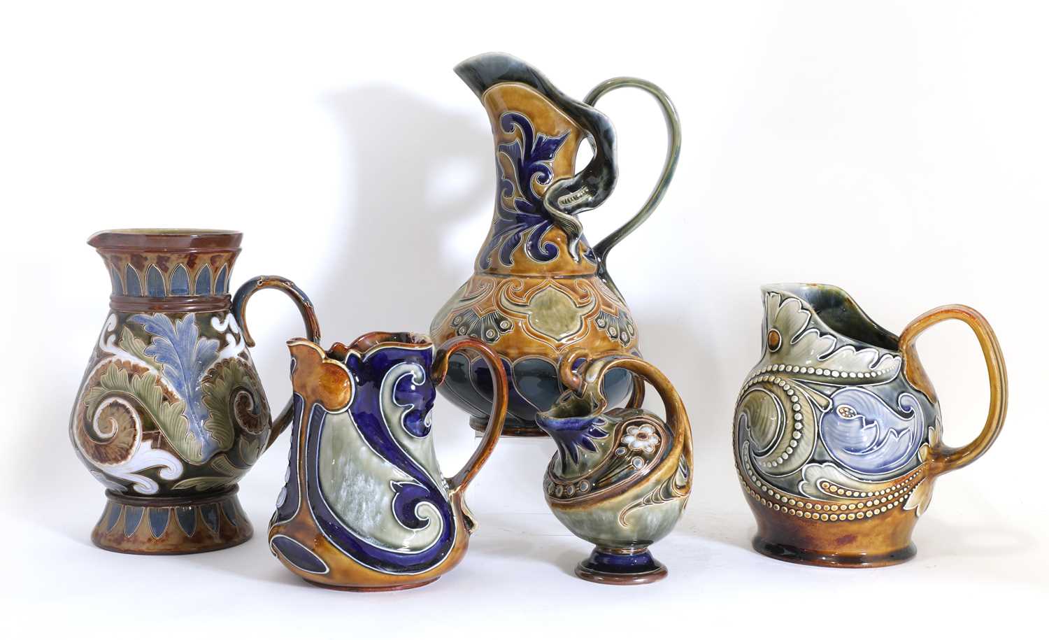 Lot 85 - Five Doulton Lambeth stoneware jugs