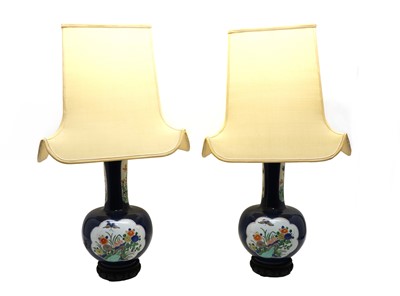 Lot 208 - A pair of blue porcelain lamps