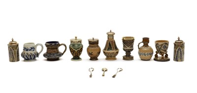 Lot 47 - A cased set of four Doulton Lambeth stoneware cruets