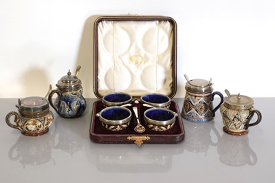 Lot 47 - A cased set of four Doulton Lambeth stoneware cruets