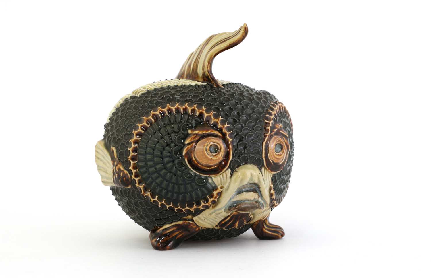 Lot 55 - A Doulton Lambeth figural stoneware jar and cover
