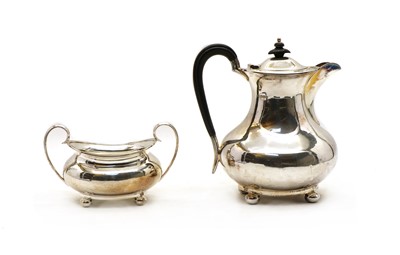 Lot 5 - A silver hot water jug and twin-handled sugar bowl