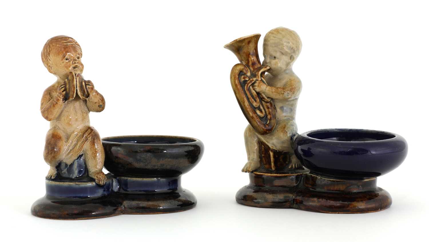 Lot 57 - Two Doulton stoneware figural salts
