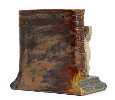 Lot 61 - A Doulton Lambeth stoneware spill vase, 'Sharpening Them Up For Somebody'