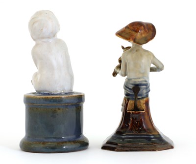 Lot 71 - A Doulton stoneware 'Merry Musician' menu holder