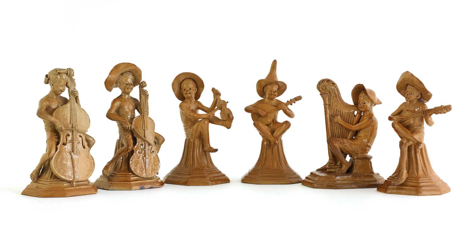 Lot 75 - Six Doulton stoneware 'Merry Musician' figures