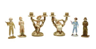 Lot 110 - A pair of Royal Worcester double figural candlesticks